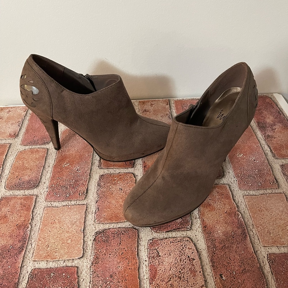 Ankle Boots Size 7 with 4" platform heels and design cutouts on heels.